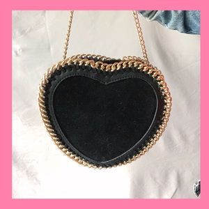 Black heart shaped, suede bag with gold chain trim